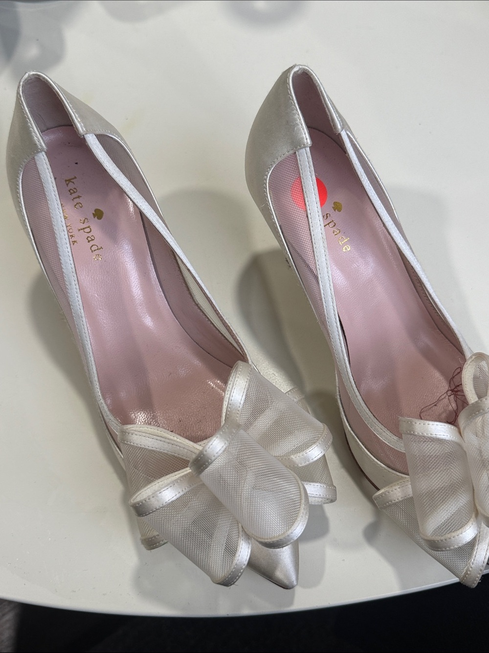 kate spade ivory bow pointed-toe pumps with pink lining